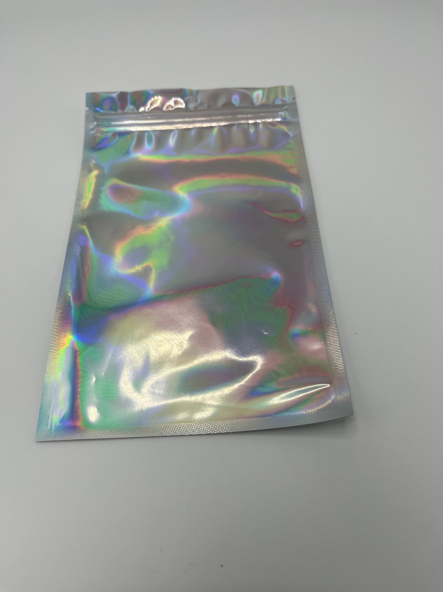 4 oz Transparent Front and Laser Effect Back Flat Pouches