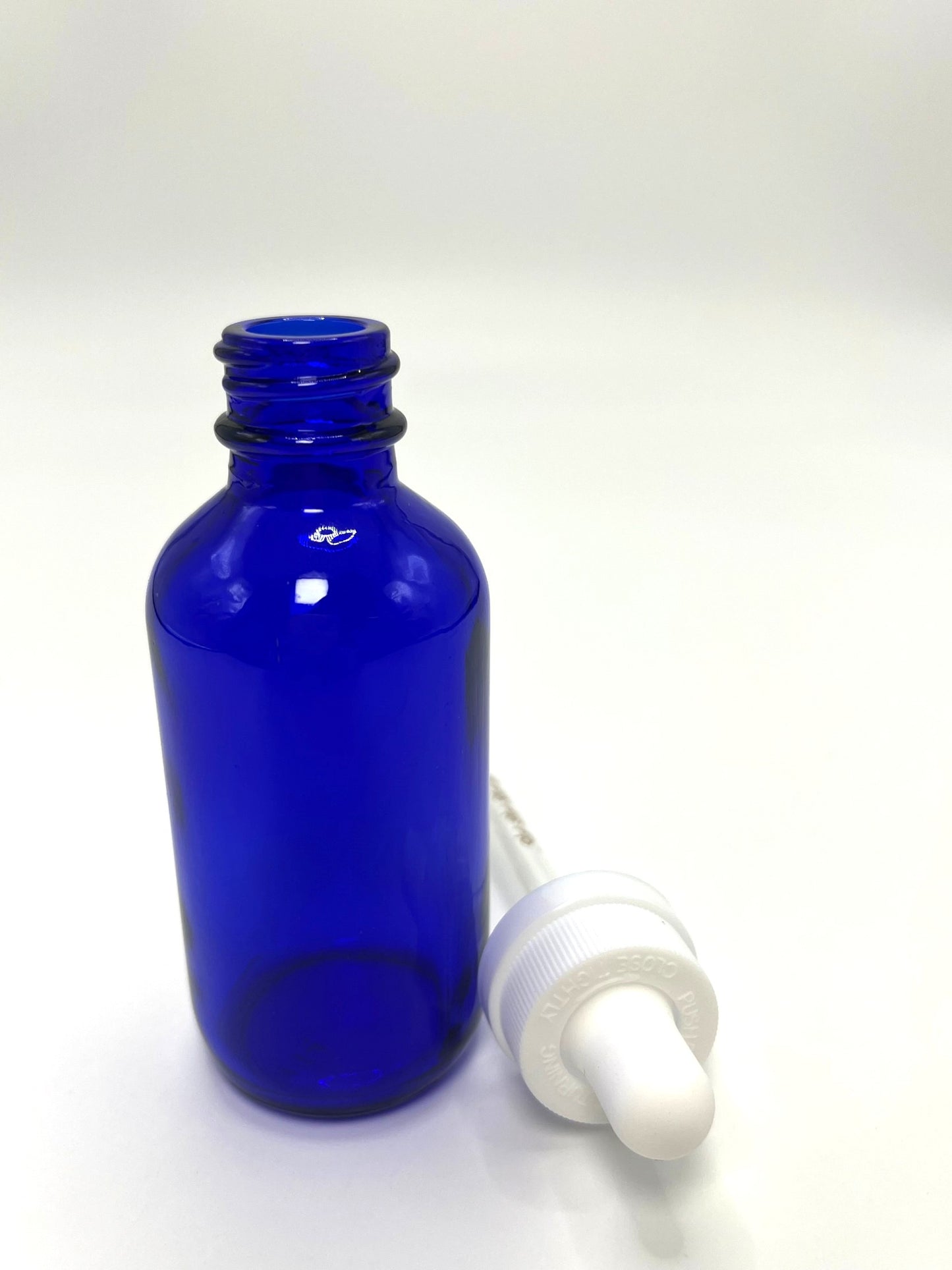 2 oz Cobalt Blue Boston Round Bottle with Graduated CR Glass Dropper