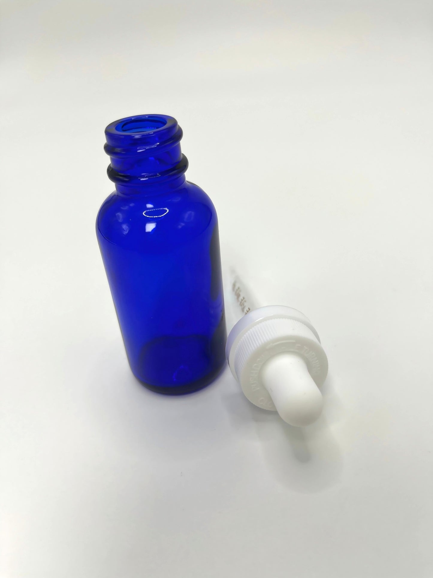 1 oz Cobalt Blue Boston Round Bottle with Graduated CR Glass Dropper