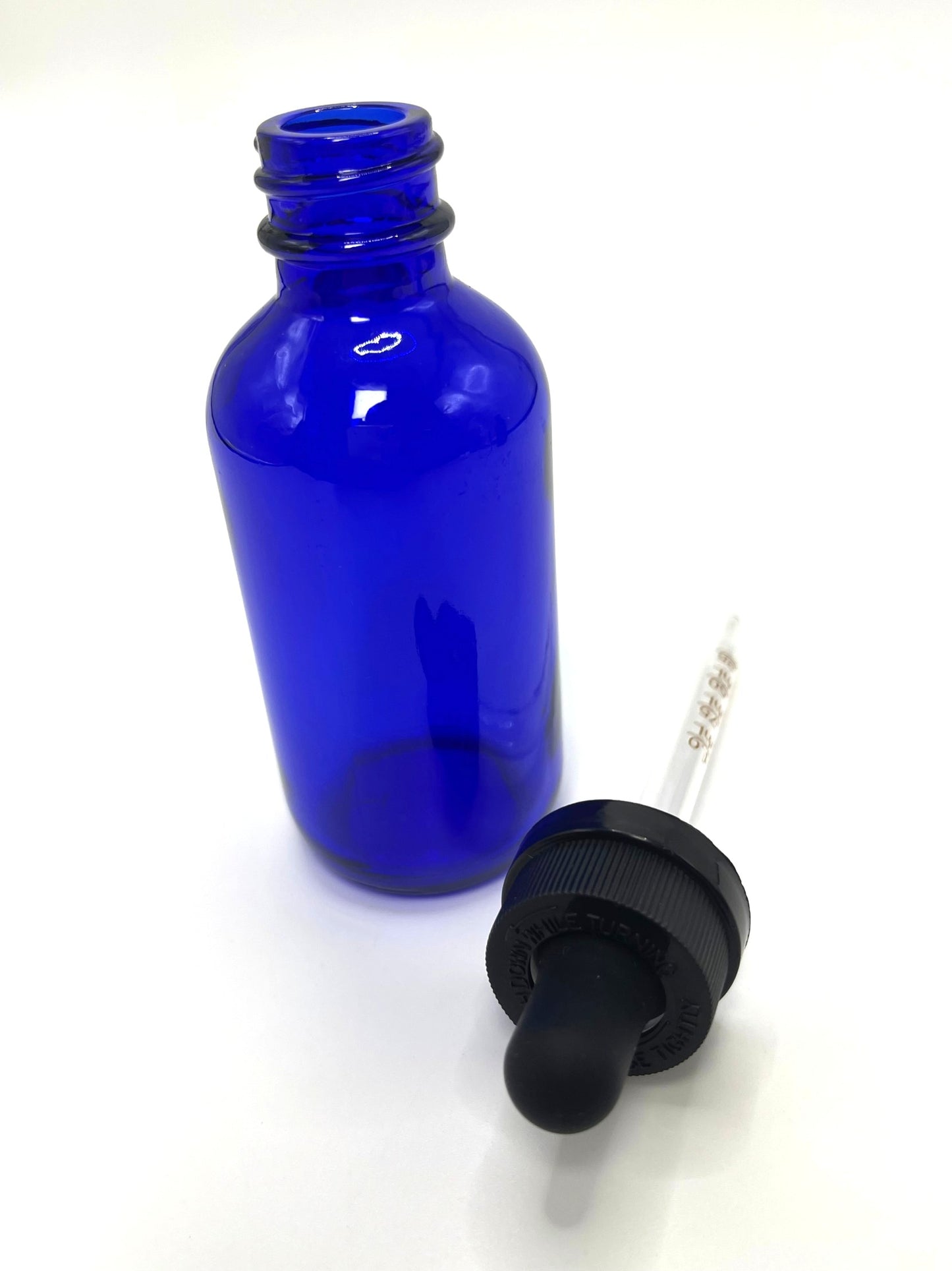 2 oz Cobalt Blue Boston Round Bottle with Graduated CR Glass Dropper