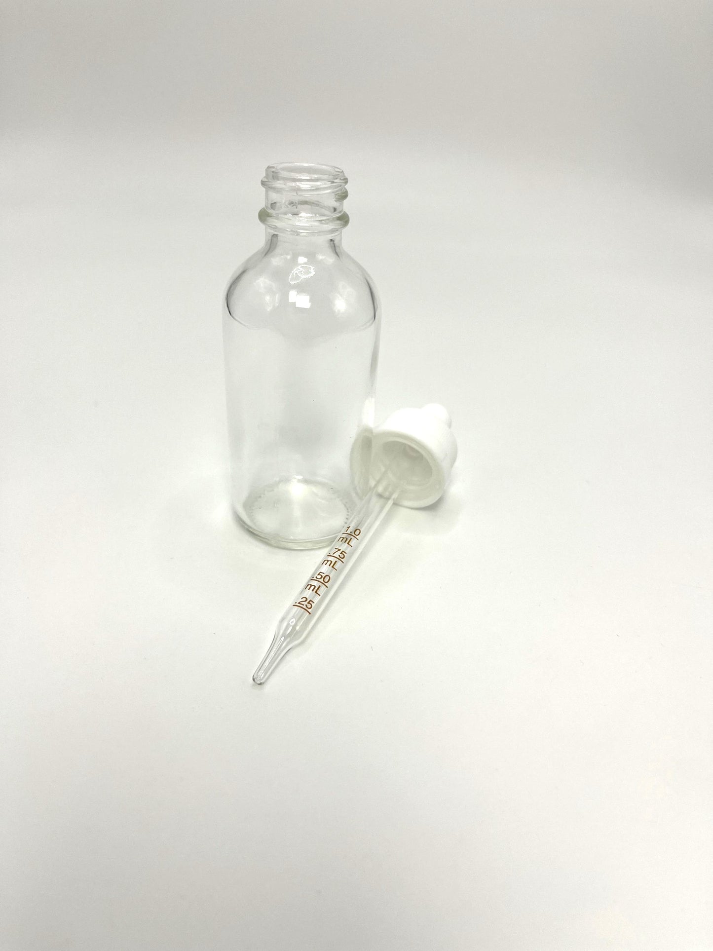 2 oz Clear Boston Round Bottle with Graduated CR Glass Dropper
