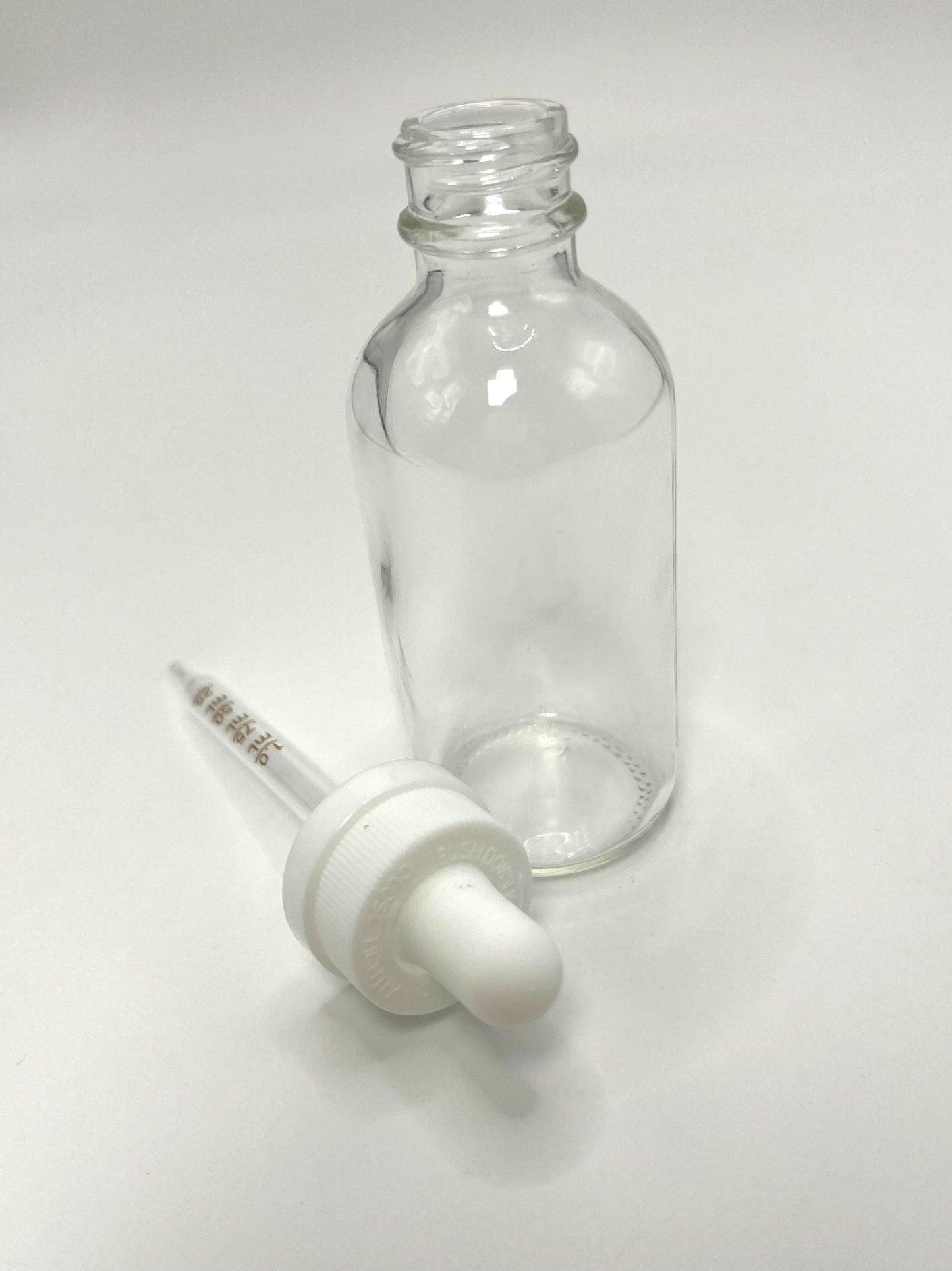 2 oz Clear Boston Round Bottle with Graduated CR Glass Dropper