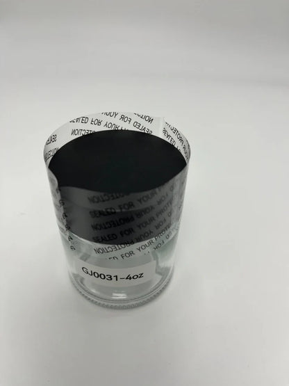 Transparent shrink band applied to 53-400 cannabis jar for secure packaging